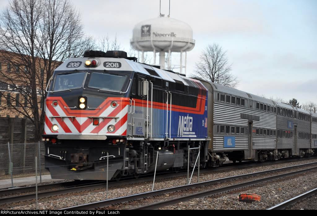 Outbound commuter approaches the station to makes its stop